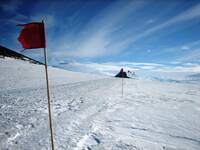 Castle Rock and the flags with Erebus.JPG